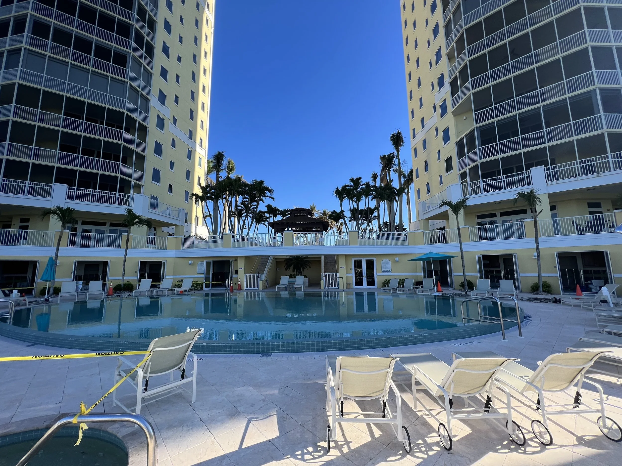 Resort-style swimming pool and outdoor living area designed for a luxury residential community in Southwest Florida