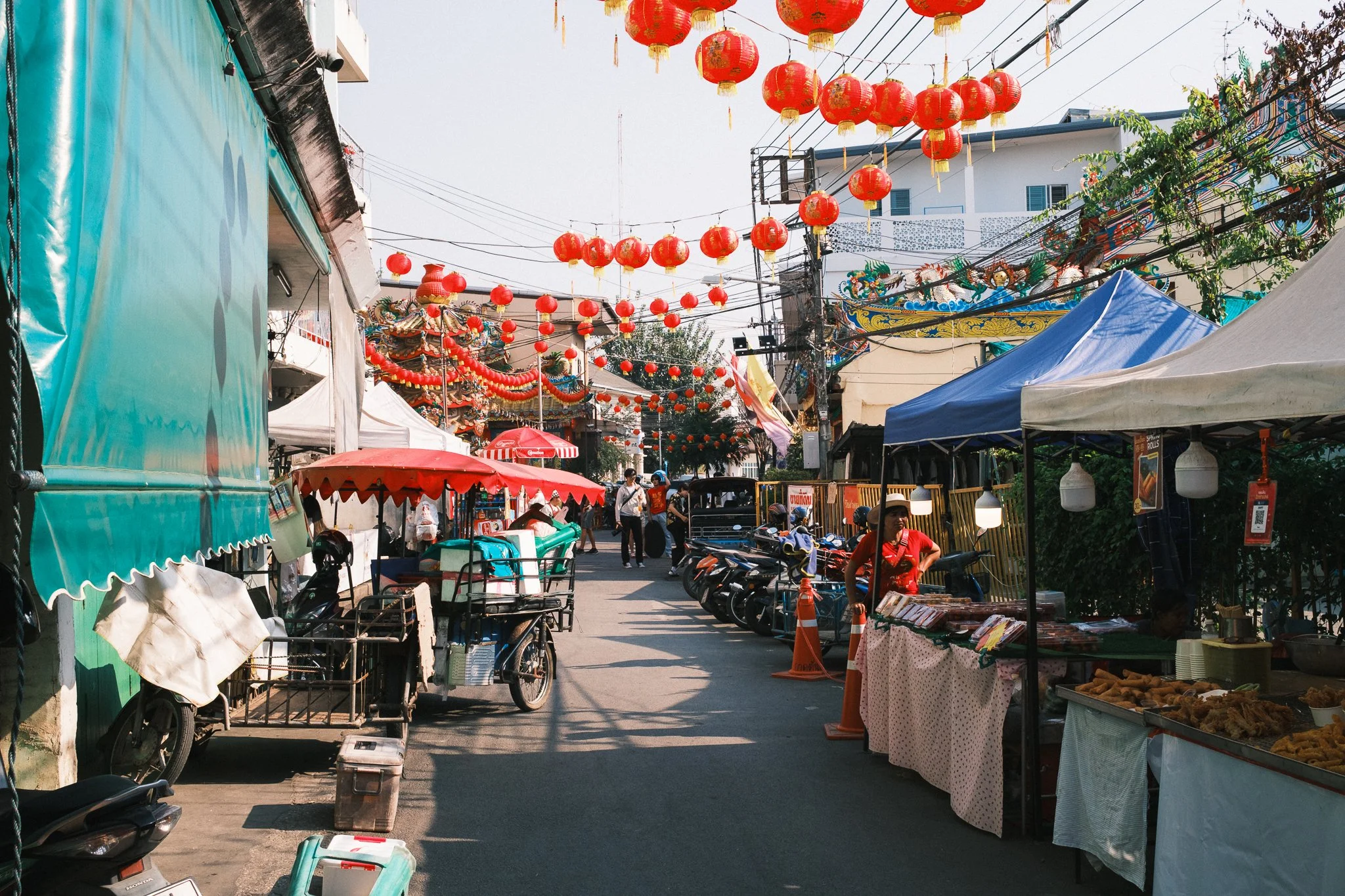 Street in Chinatown Chiang Mai during lunar new year with food stands