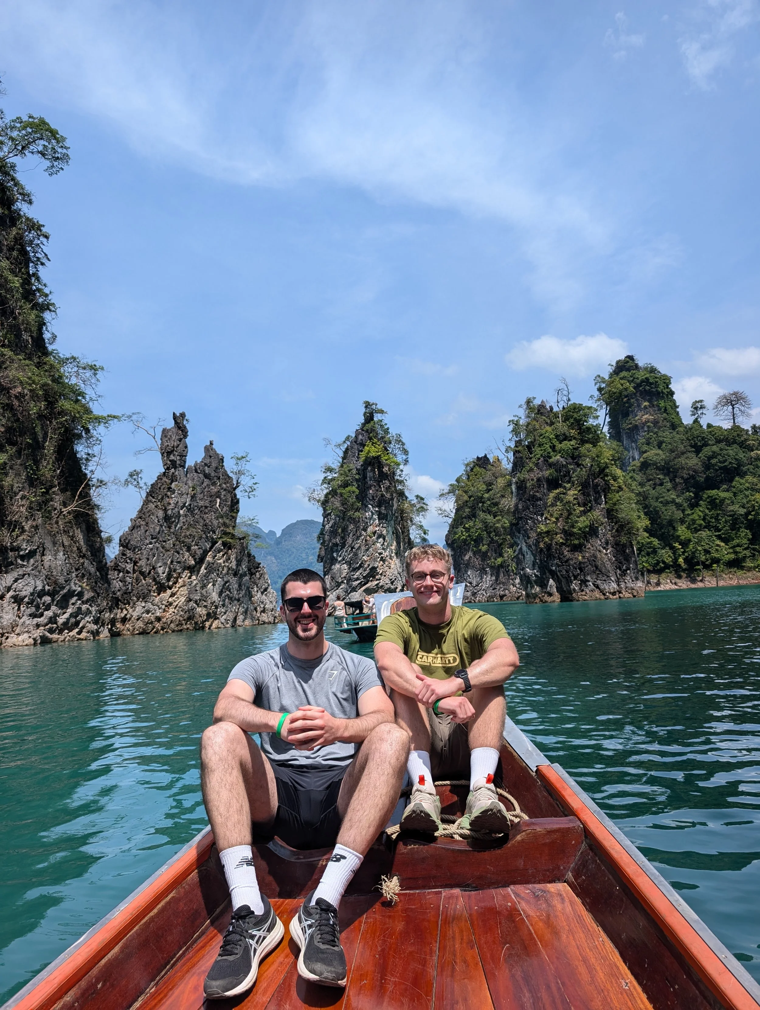 Nathan Maguire travelling through scenic river landscape in Khao Sok National Park, Surat Thani, Thailand.