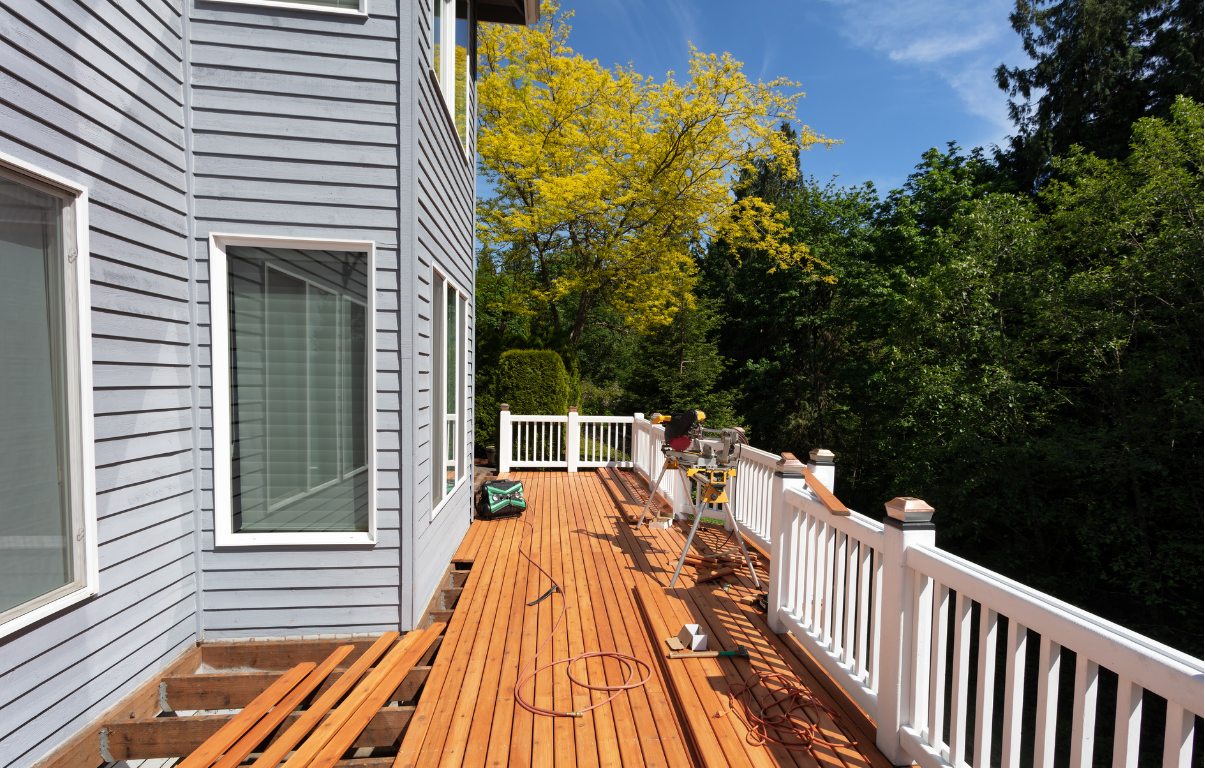 New exterior. Pristine siding, new windows, and a deck renovation in the process of being completed.
