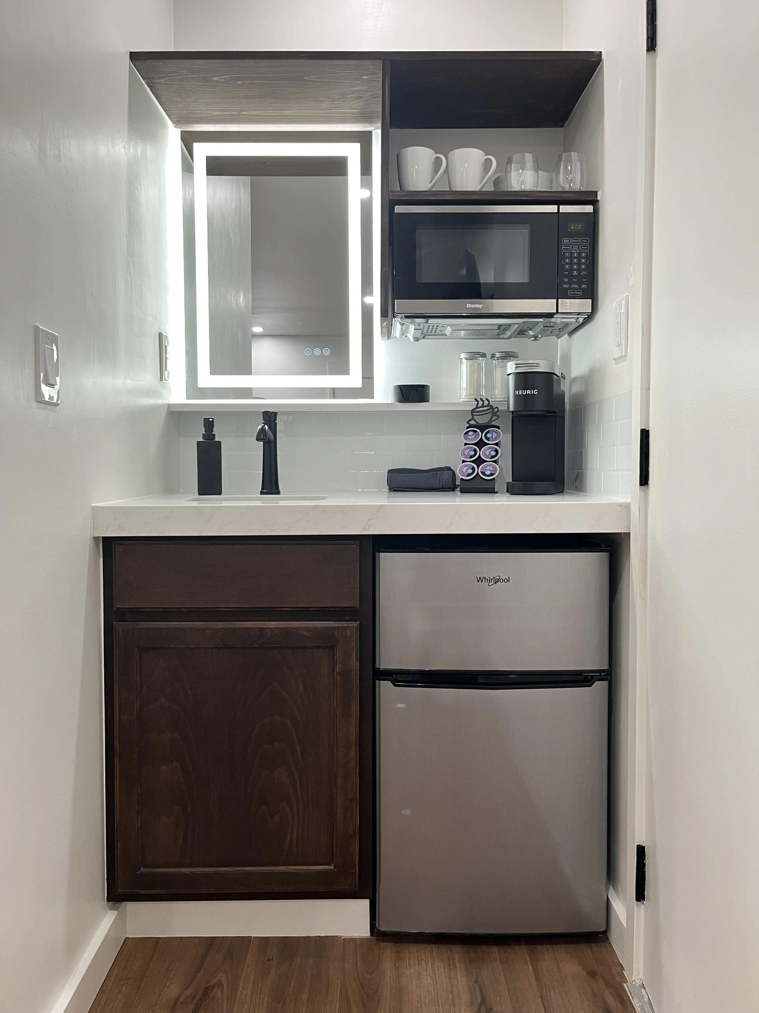 Kitchenette with coffee station, microwave, sink, and mini fridge at BeltLine Studio ATL