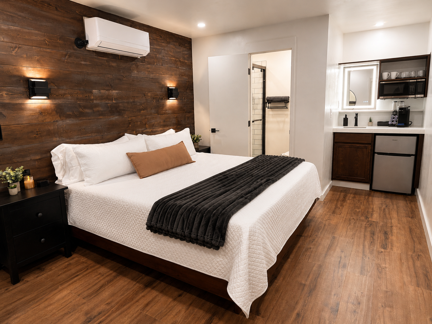 King bedroom with wood accent wall inside BeltLine Studio ATL near Atlanta BeltLine
