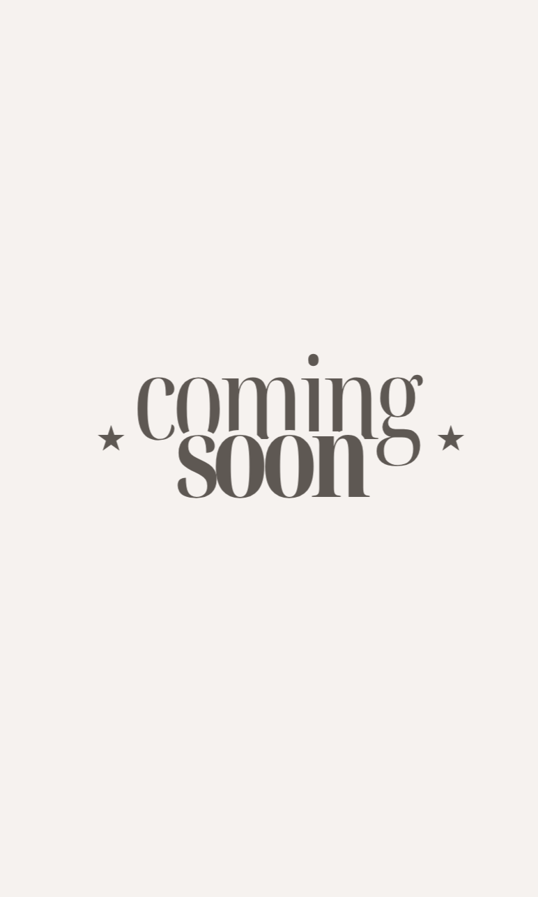 A minimalist announcement with a light background and black text that reads 'coming soon' with small decorative stars on each side.