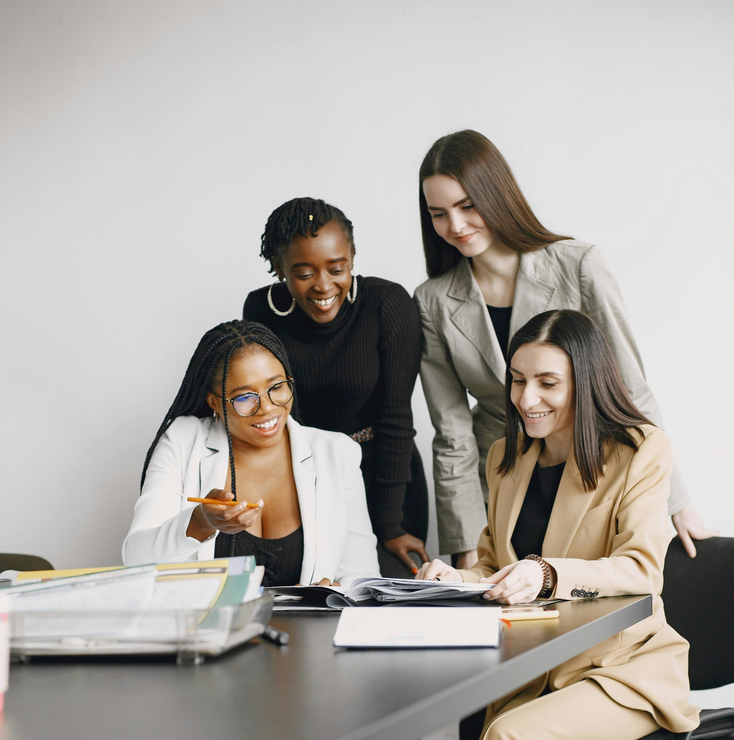 Diverse team collaborating during a workplace planning session focused on communication, organization, and team productivity.