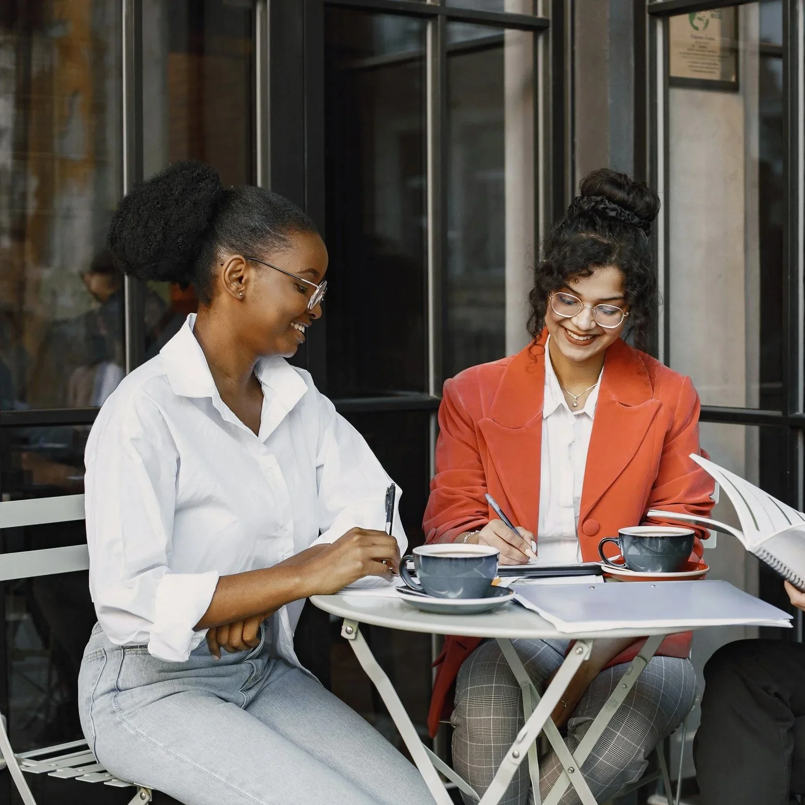 Two women collaborating during a Personal Operations Strategy Session focused on creating clarity, personalized systems, and practical next steps.