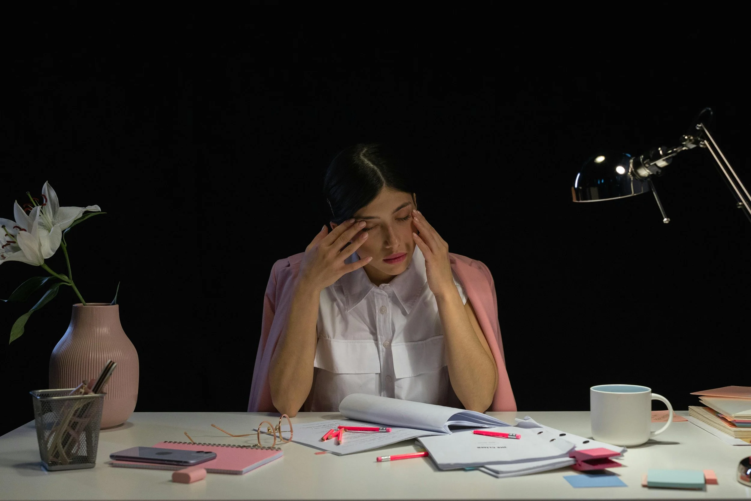Professional experiencing stress and mental overload while managing work responsibilities.