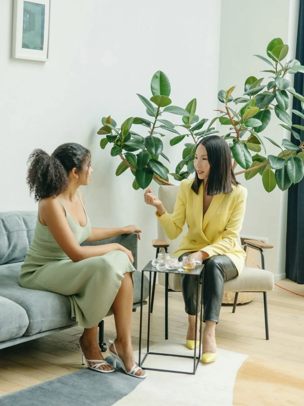 Two women discussing goals during a one-on-one strategy session focused on clarity, organization, and practical next steps.