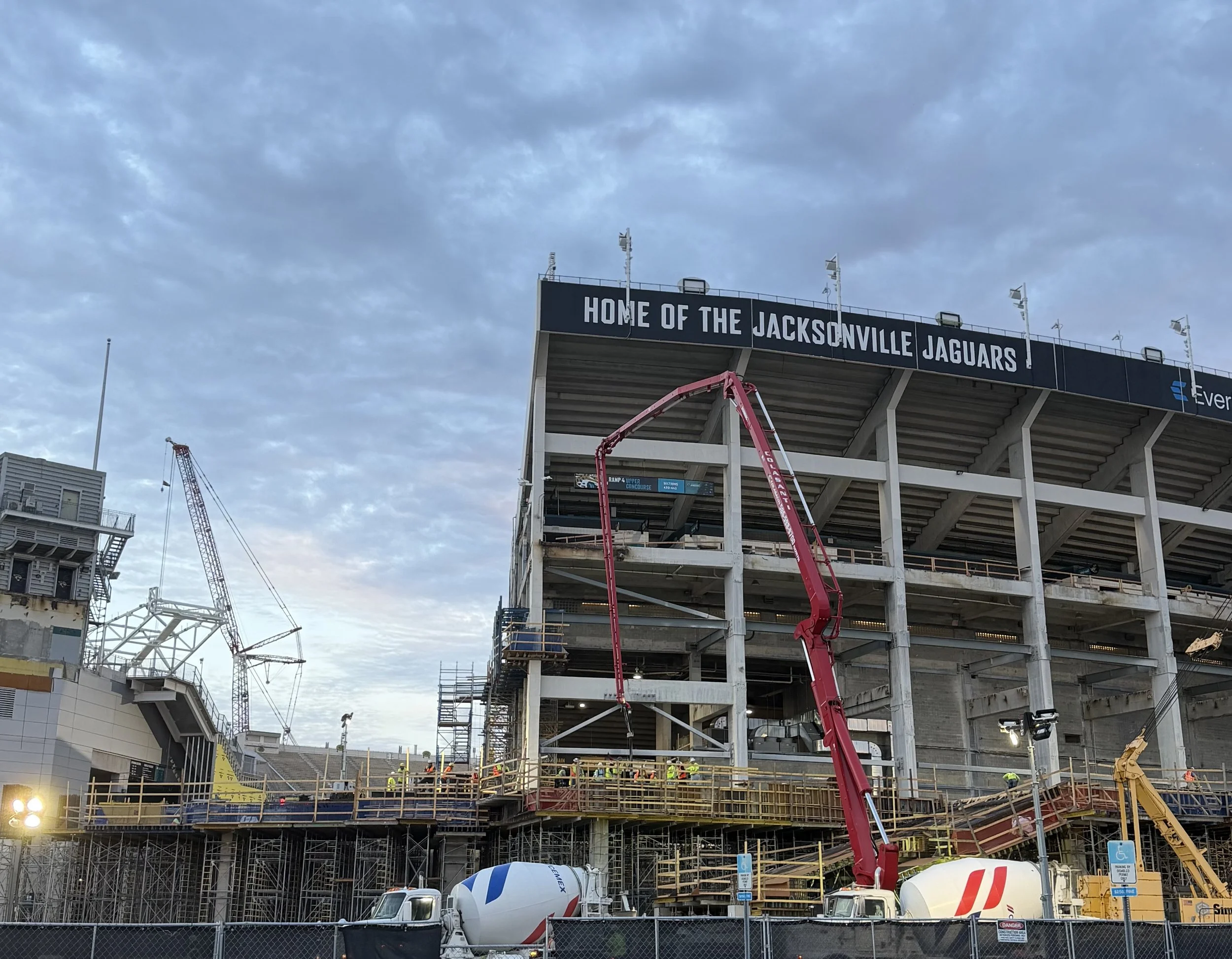Concrete pour and construction activities on multi-billion-dollar NFL stadium renovation project.