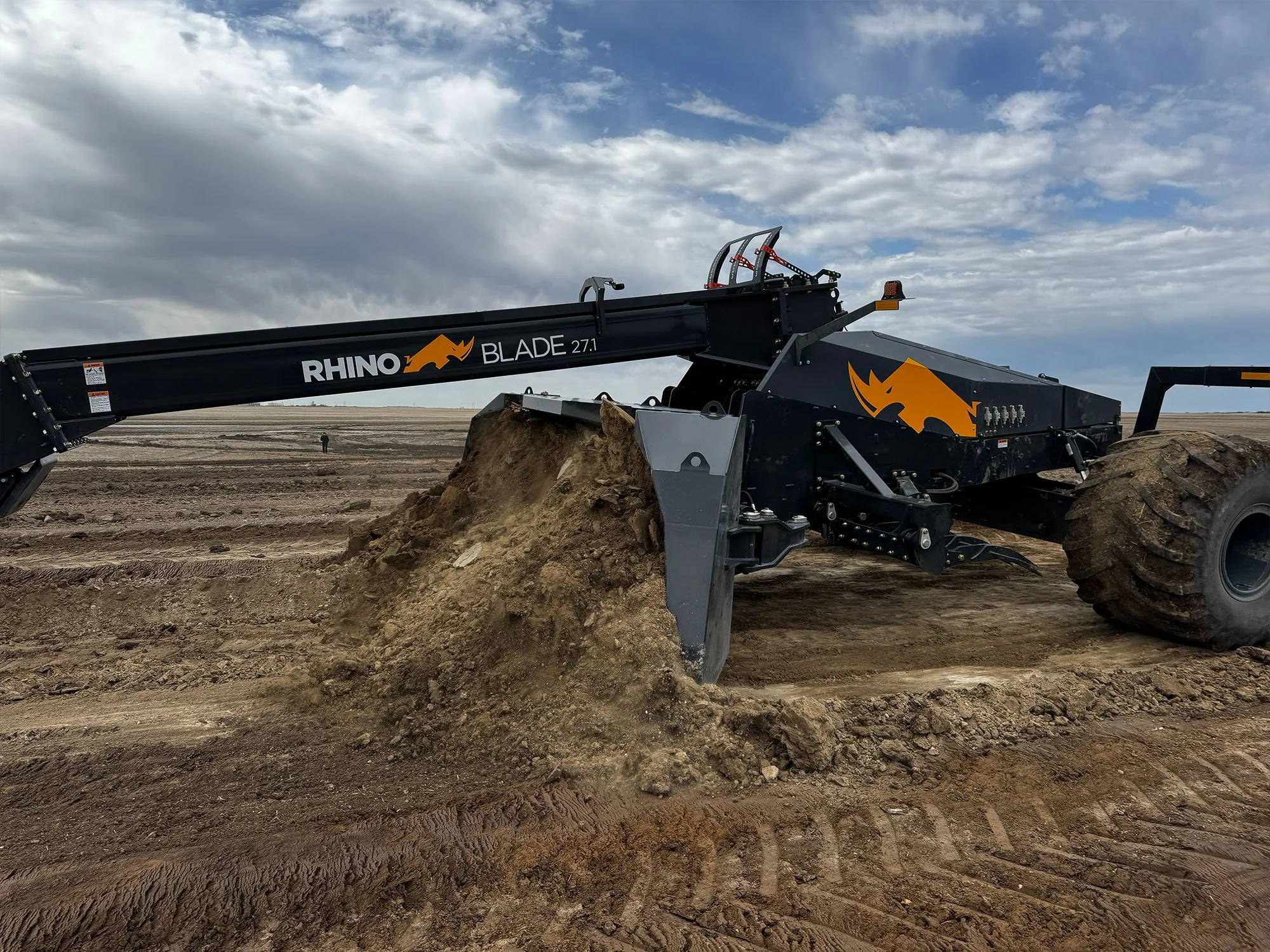 Rhino Blade™ Dynamic Wings rolled forward to gather and carry material.jpg
