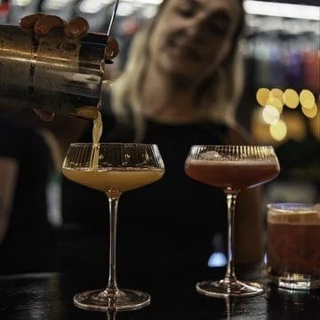 Cocktails being poured at the bar