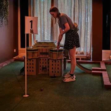 Mini golf inside Chipper Social