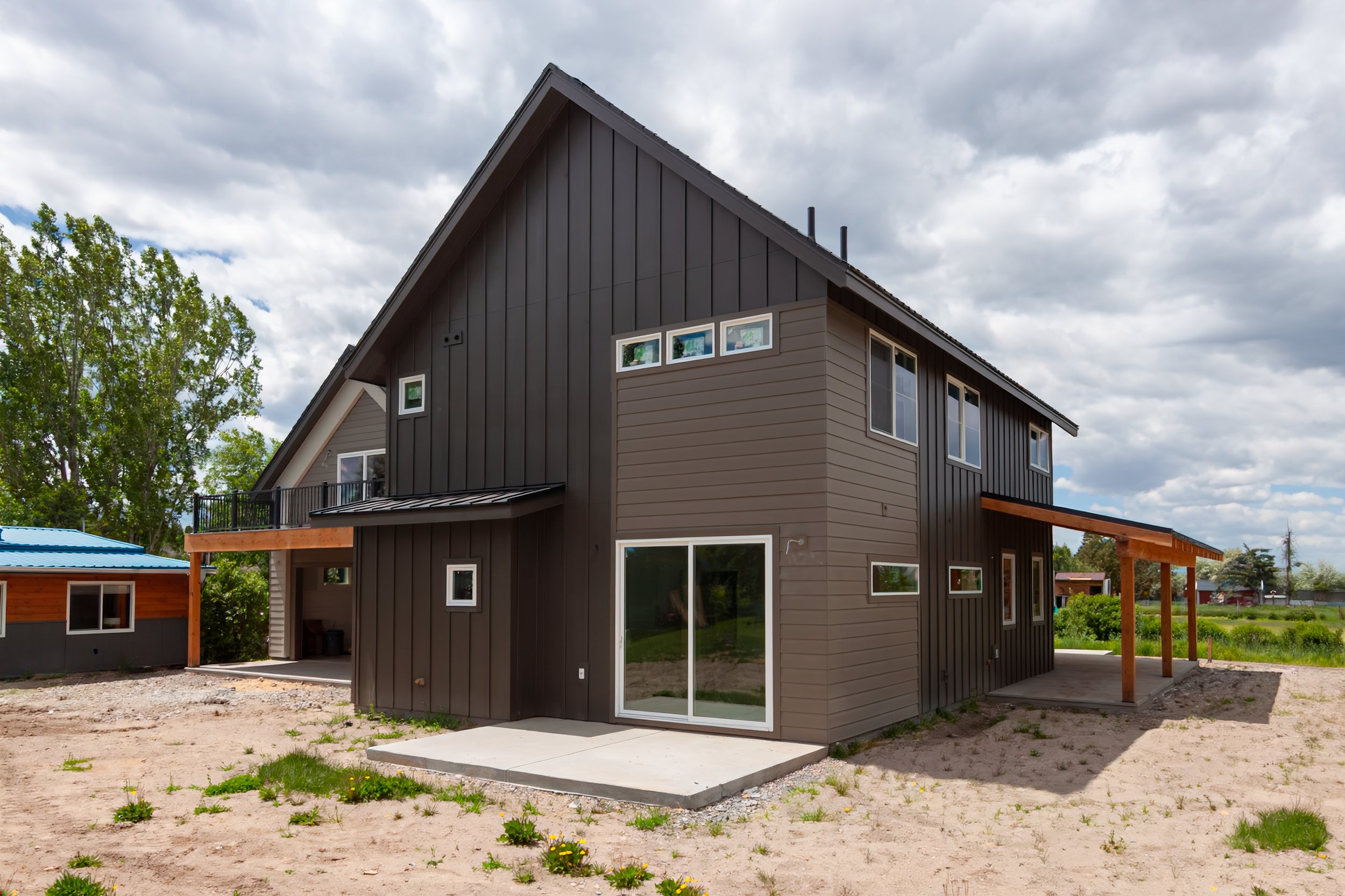A 2-story, 3,500-sf residence with vaulted Living Room and Upper Level Loft in addition to a Gym and Office area above the Garage just north of Bozeman.