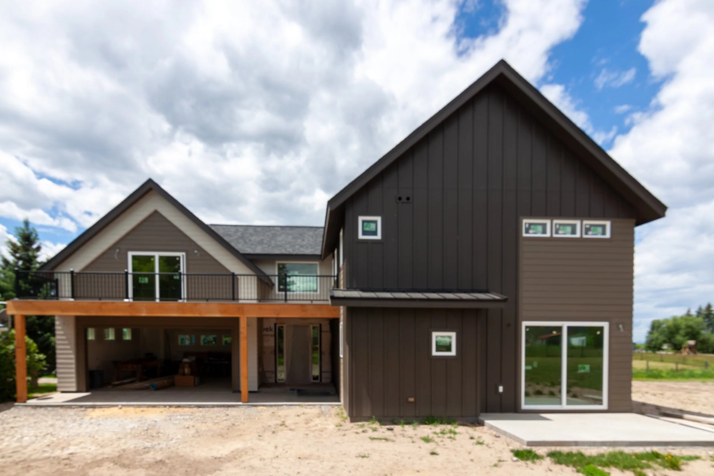 A 2-story, 3,500-sf residence with vaulted Living Room and Upper Level Loft in addition to a Gym and Office area above the Garage just north of Bozeman.