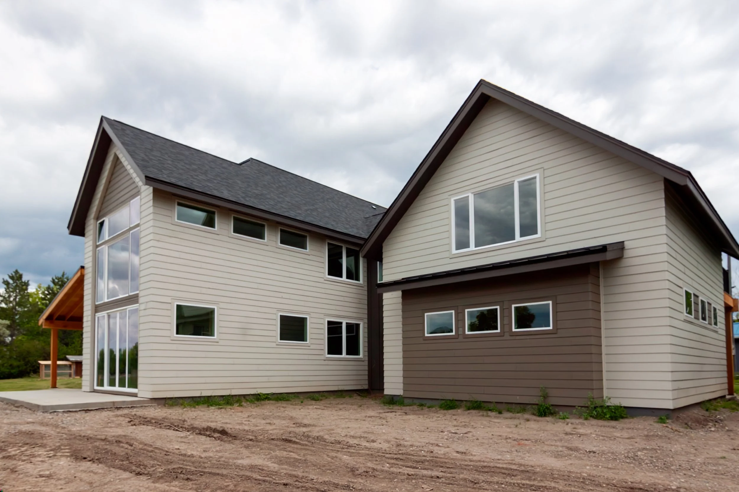 A 2-story, 3,500-sf residence with vaulted Living Room and Upper Level Loft in addition to a Gym and Office area above the Garage just north of Bozeman.