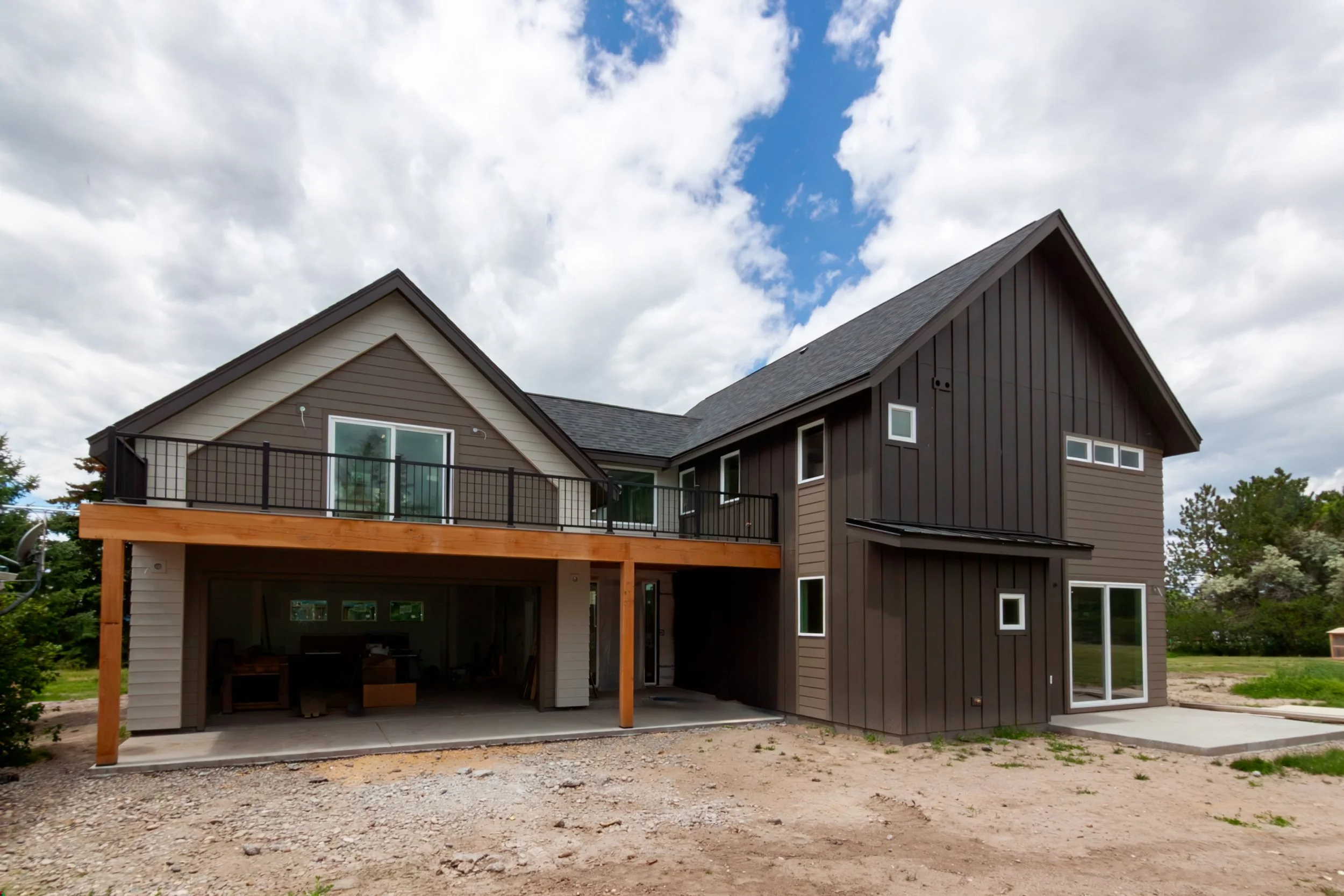 A 2-story, 3,500-sf residence with vaulted Living Room and Upper Level Loft in addition to a Gym and Office area above the Garage just north of Bozeman.