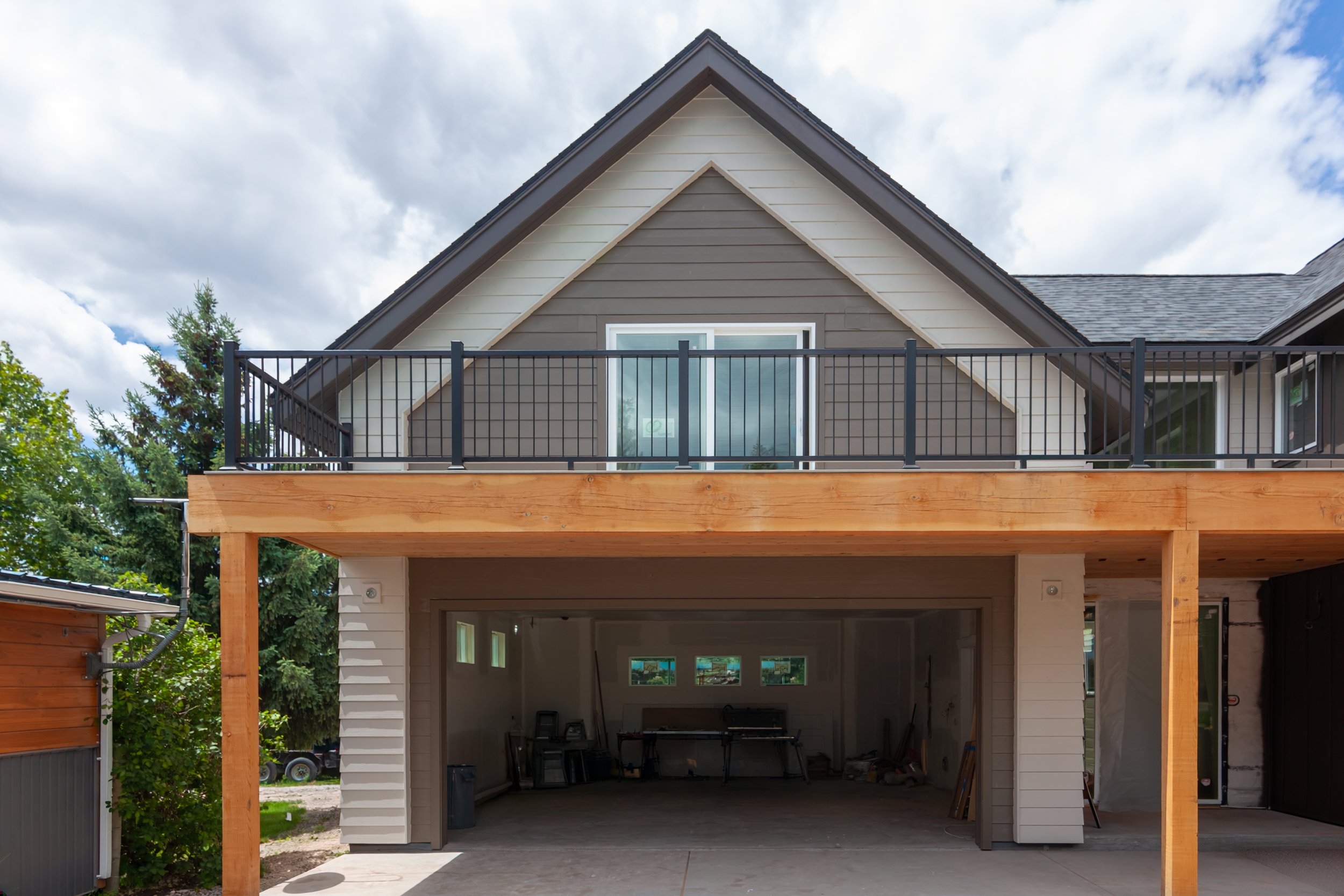 A 2-story, 3,500-sf residence with vaulted Living Room and Upper Level Loft in addition to a Gym and Office area above the Garage just north of Bozeman.
