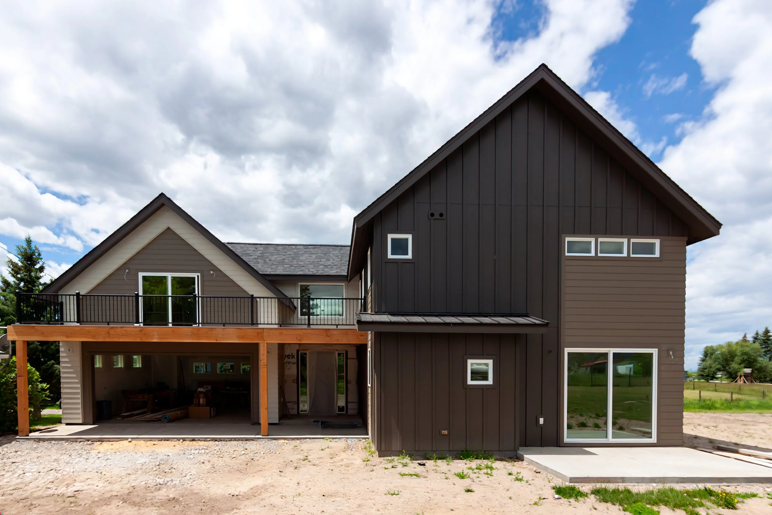 A 2-story, 3,500-sf residence with vaulted Living Room and Upper Level Loft in addition to a Gym and Office area above the Garage just north of Bozeman.