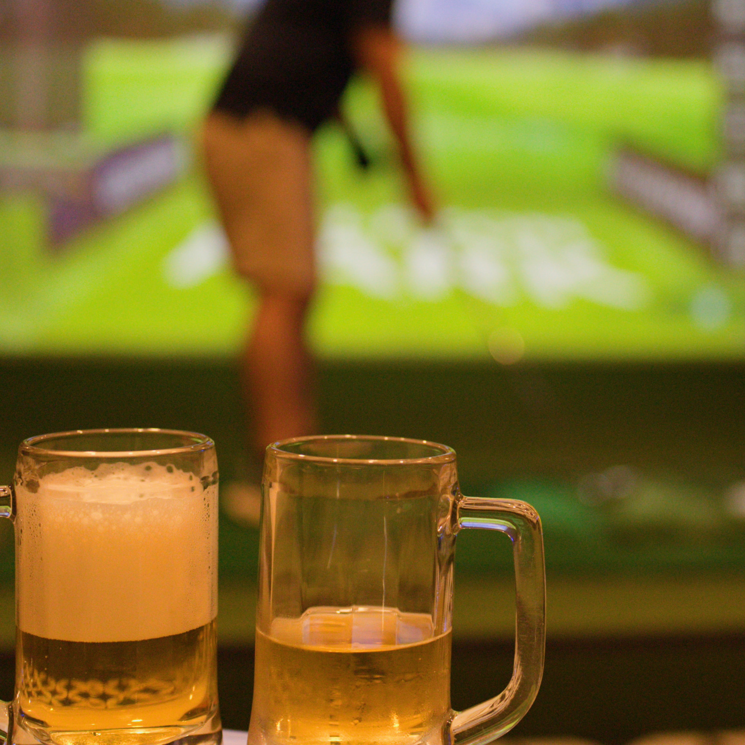 Four beer mugs filled with beer, placed side by side on a table. FORE! Golf & Game Simulator — Book a Bay in East Hartford, CT East Hartford Flex Space