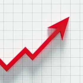 A red upward-trending arrow on a graph with grid lines, indicating growth or increase.
