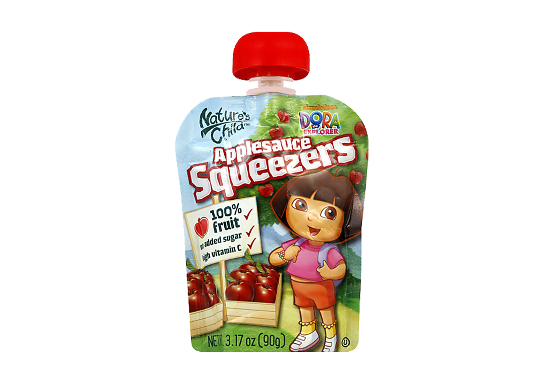 Dora the Explorer character on a pouch of Nickelodeon applesauce squeezers with a red cap