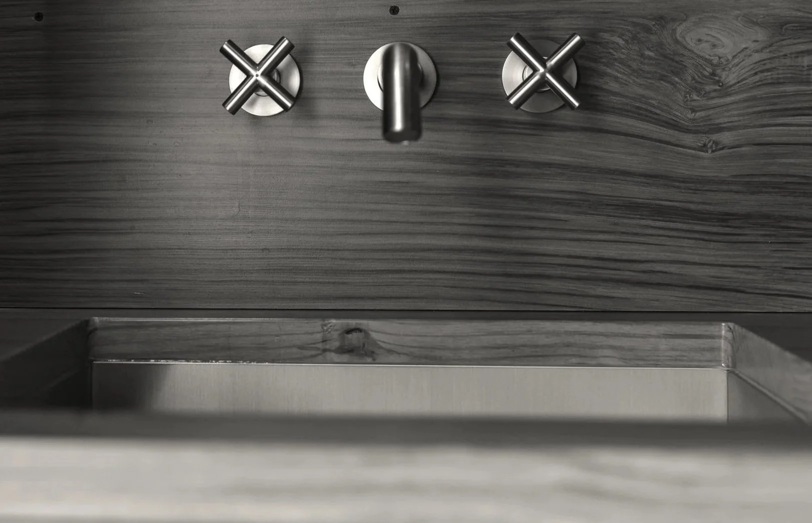 Black and white image of faucet with double adjustments for a Bend Oregon fine carpentry redwood vanity project by KJS Construction