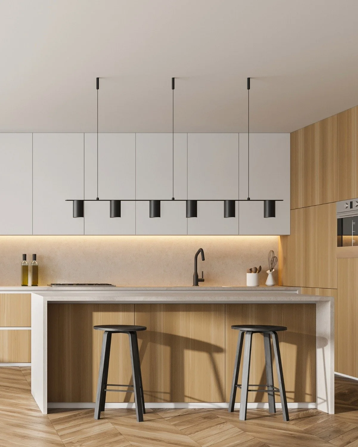Modern kitchen with white and wood cabinets, black pendant lights, a black faucet, and two stools at a white and wood kitchen island.