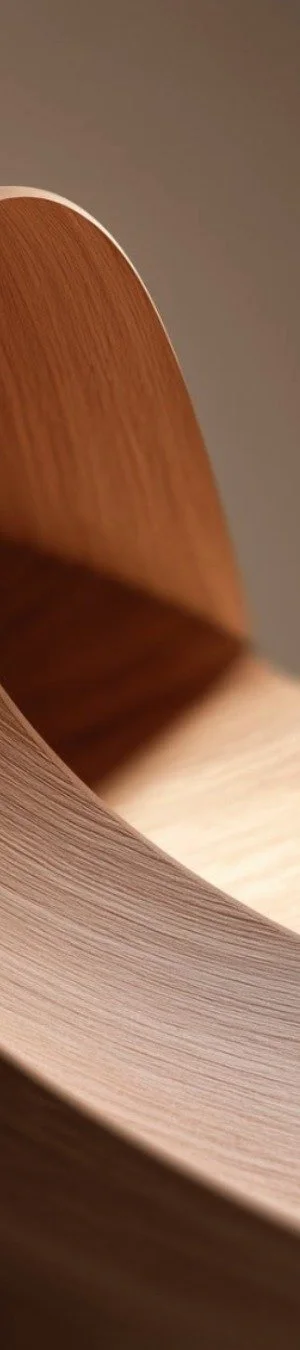 Close-up of a curved wooden surface with smooth texture and natural wood grain.