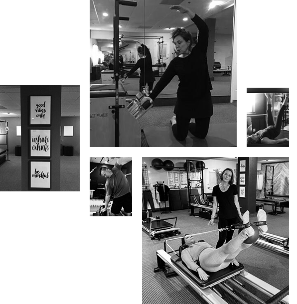 People exercising and practicing Pilates in a gym, with motivational signs on the wall.