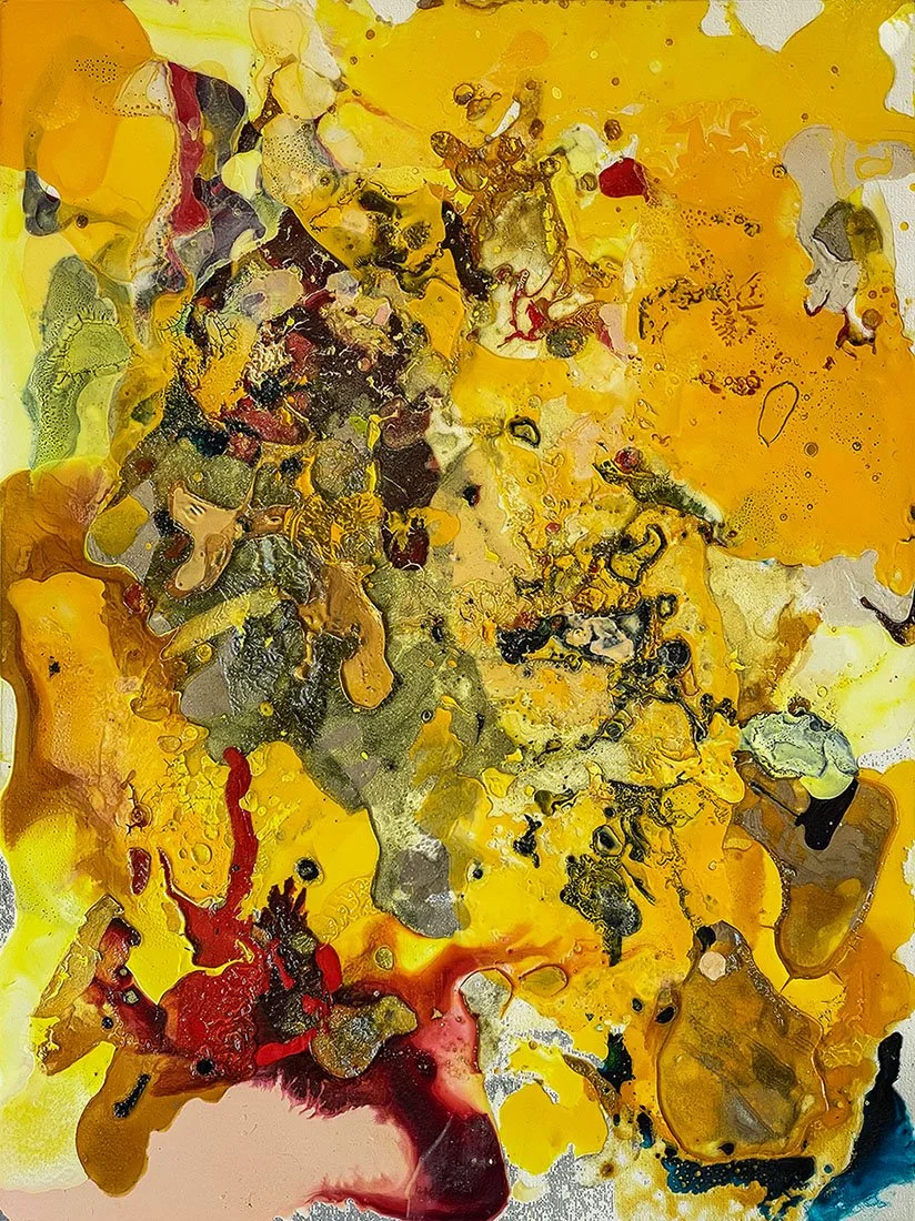 Abstract art with yellow, red, black, gray, and white paint splashes and drips.