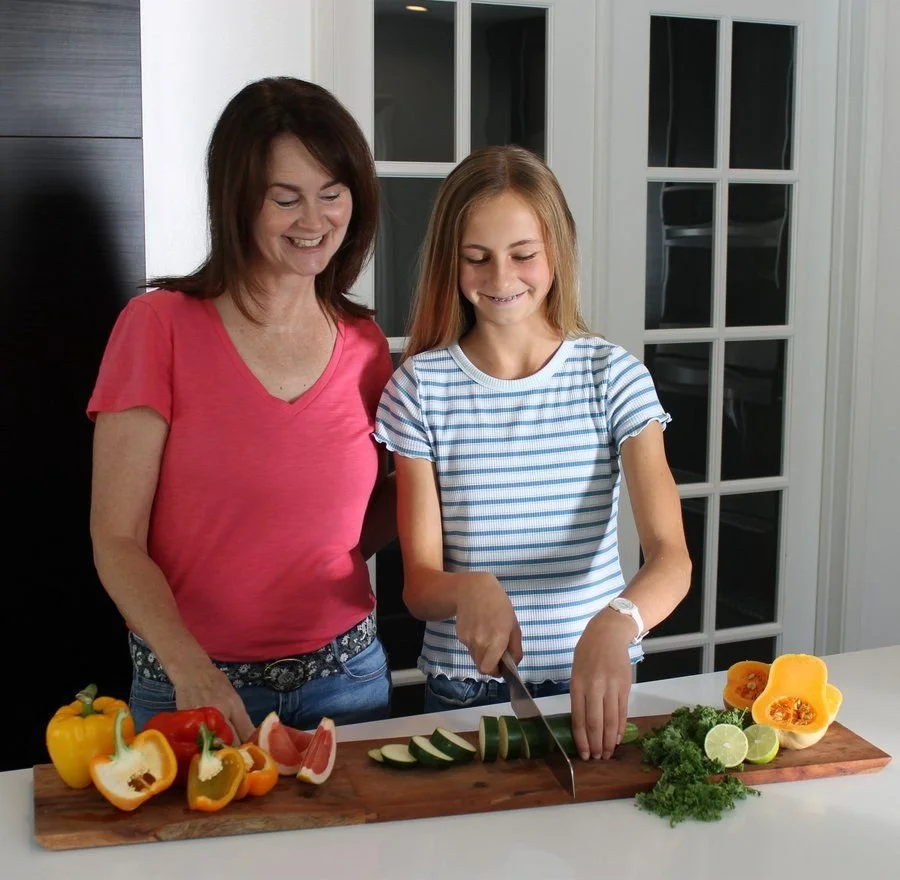 Kerry with her daughter in the kitchen
