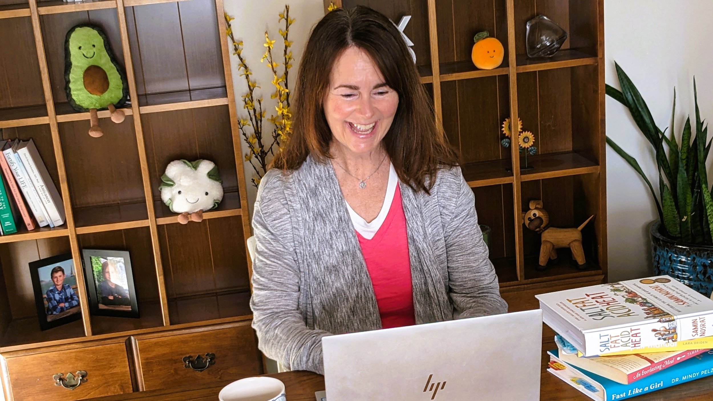 Kerry at a desk with her laptop