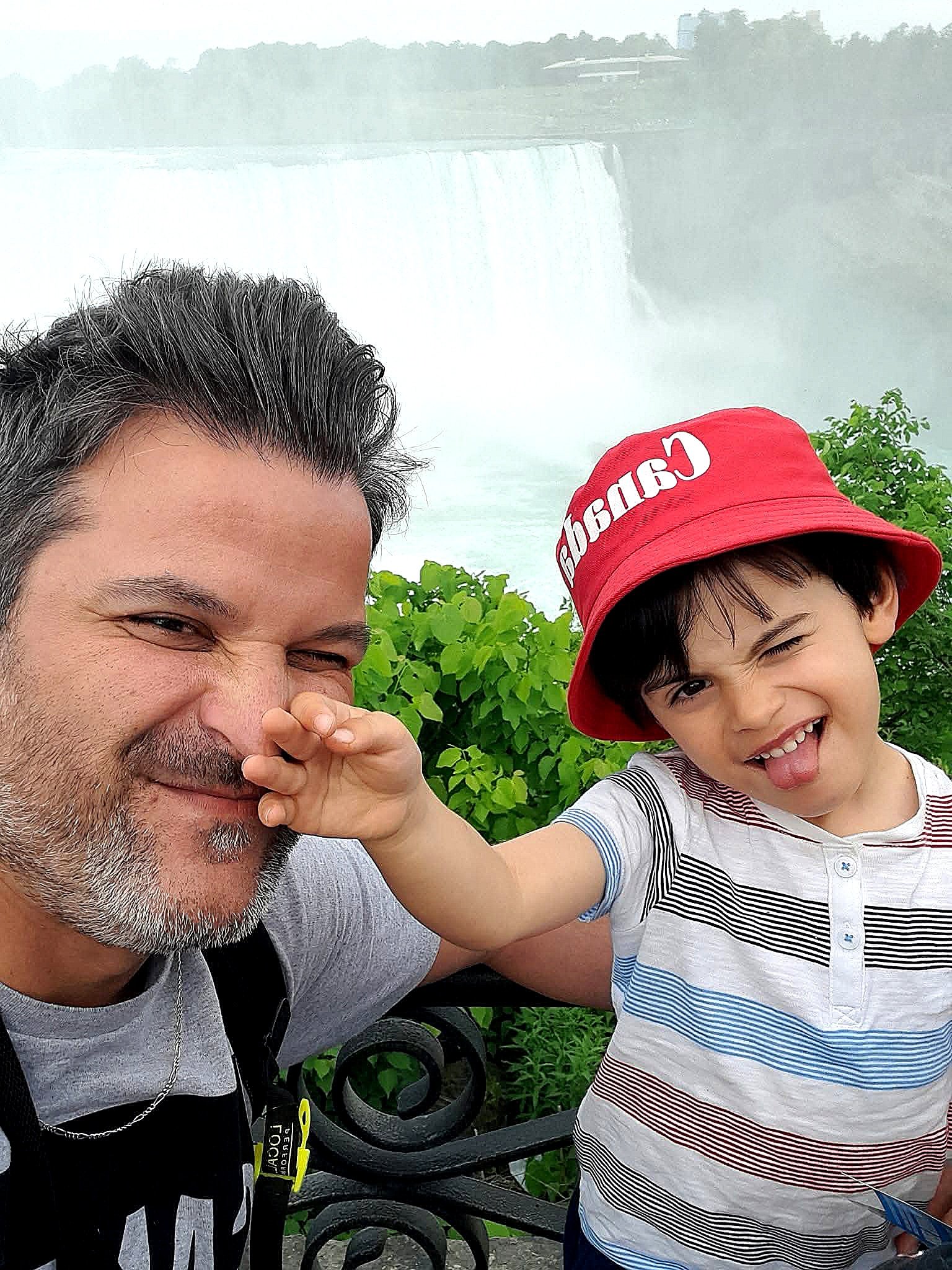 Father and child sharing a personal moment in Canada, representing the family story behind Northern Roots Travel.
