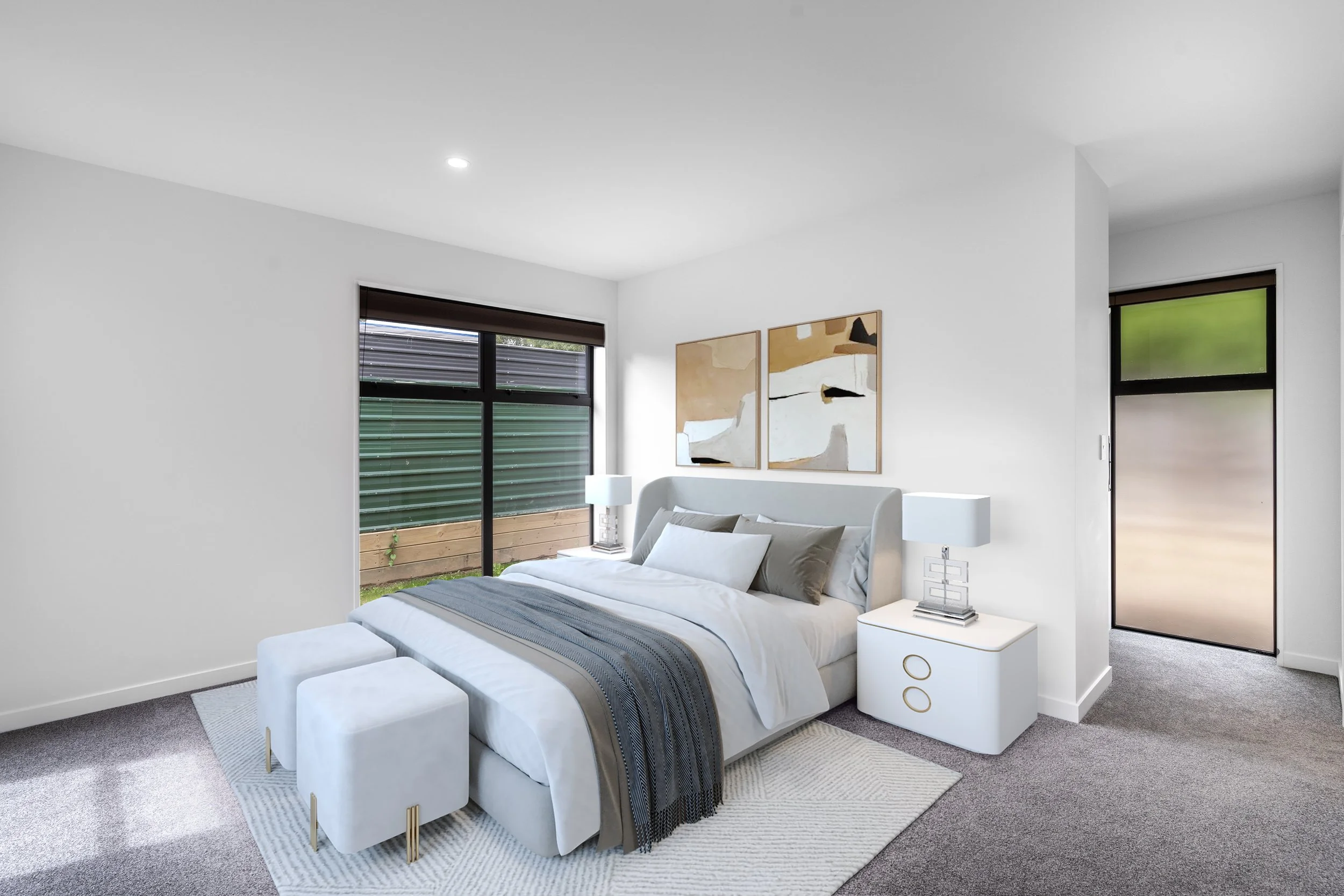 A modern bedroom with white walls, grey carpet, and black-framed windows. The bed has white bedding with grey accents and is flanked by white bedside tables. Abstract artwork hangs above the bed.