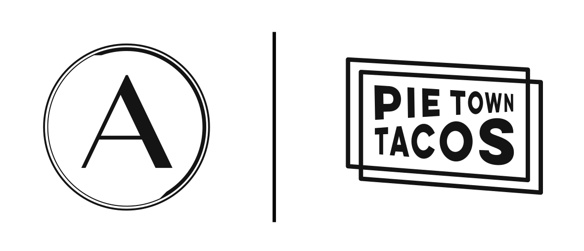 Black and white logo with two parts; left side has a circle with a capital A inside, right side has a rectangular outline with the text "Pie Town Tacos" inside.