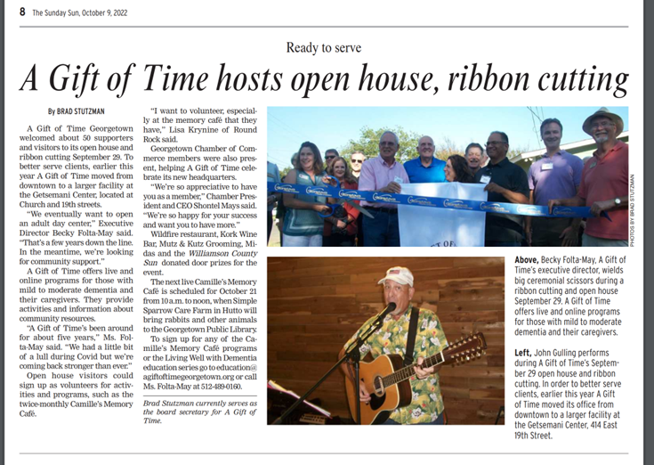 Photo of a ribbon-cutting event for 'A Gift of Time' in Georgetown, with a blue ribbon and large scissors, featuring several men and women, some wearing sunglasses, standing outside a building. A smaller inset photo shows a man playing guitar and singing into a microphone at the event.
