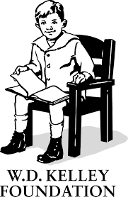 A young boy sitting in a chair reading a book, with the W.D. Kelley Foundation logo below.