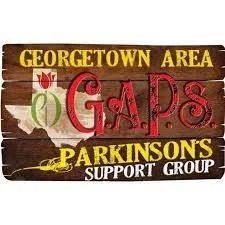 Wooden sign reading 'Georgetown Area GAPS Parkinson's Support Group' with decorative flowers and a yellow ribbon.