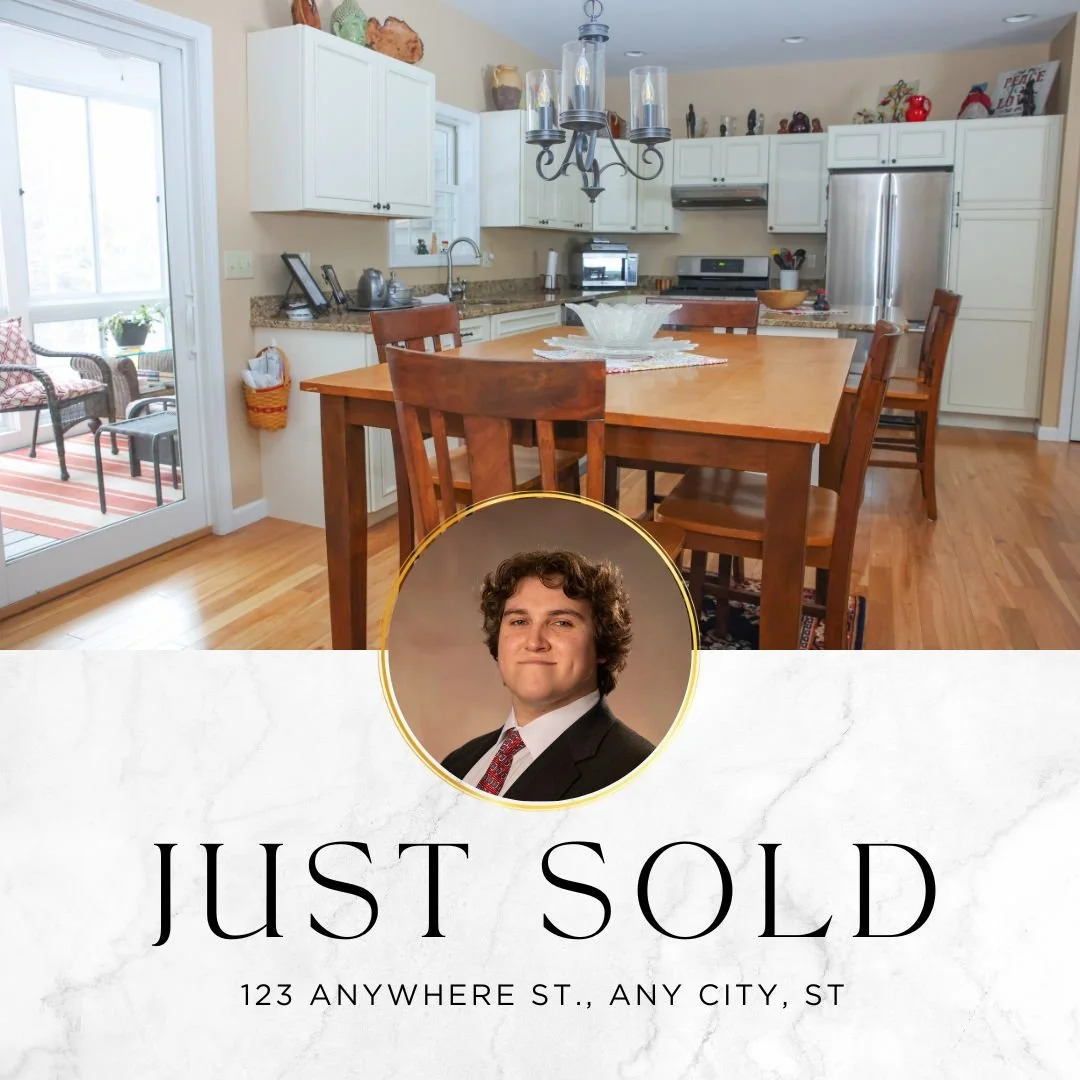 A kitchen with white cabinets, a wooden dining table with chairs, and a sliding glass door leading to a porch. There is a "Just Sold" real estate sign with a photo of a man in a suit, and the address "123 Anywhere St., Any City, ST." at the bottom.