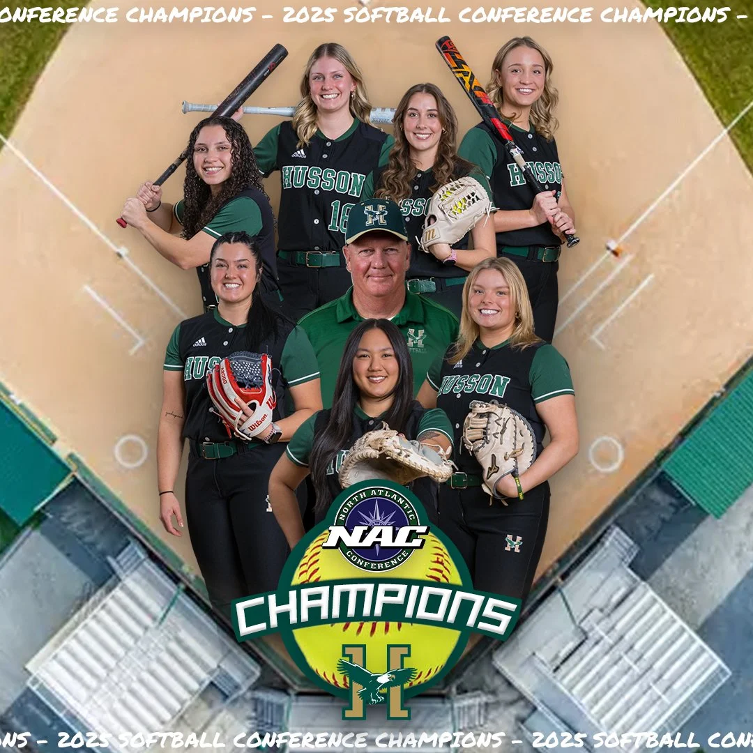 A softball team and coach celebrating their 2023 conference championship, wearing black and green uniforms with "HUSSON" on the front, posing on a softball field with a championship logo at the bottom.
