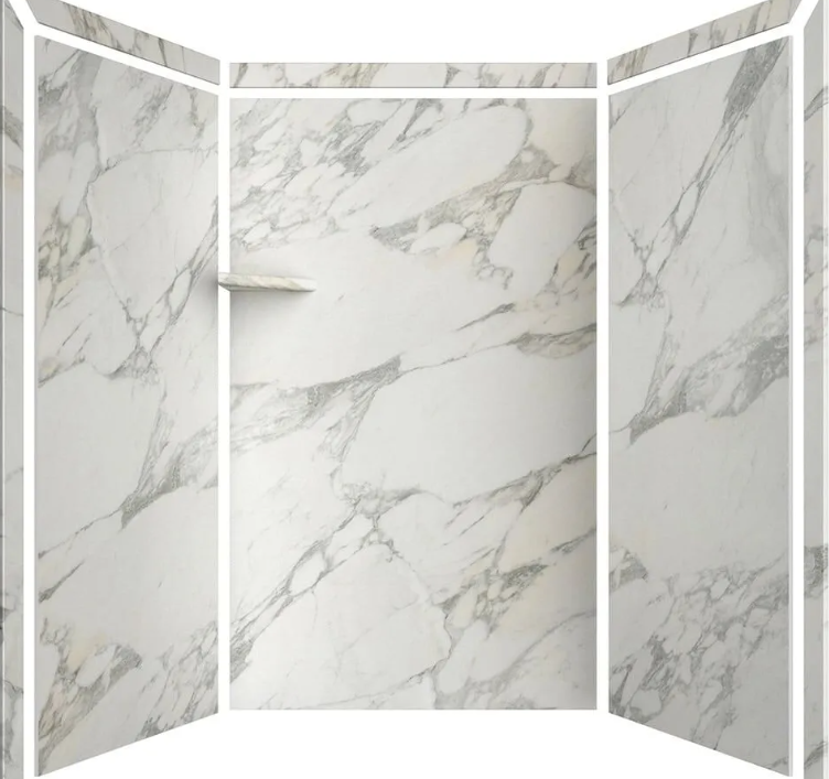 A marble shower stall with white and gray veined marble walls and a small corner shelf.