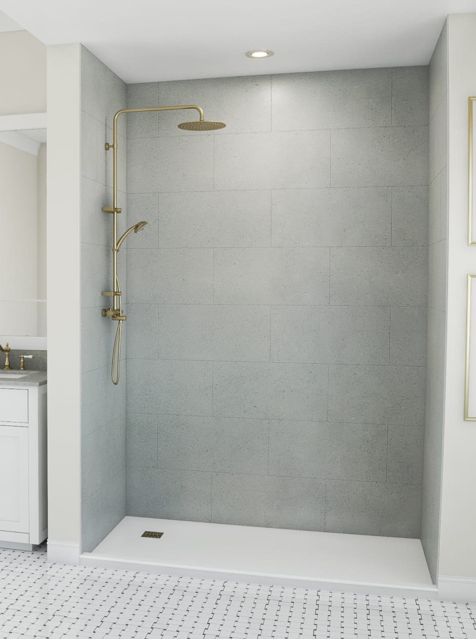 Modern walk-in shower with grey tiled wall, gold showerhead, and a white shower base, adjacent to a vanity area with a white cabinet and gold fixtures.