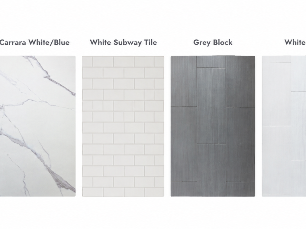 Samples of different tiles and materials for flooring or wall use, including Carrara white/blue marble, white subway tile, grey wood-look tile, and white tile.