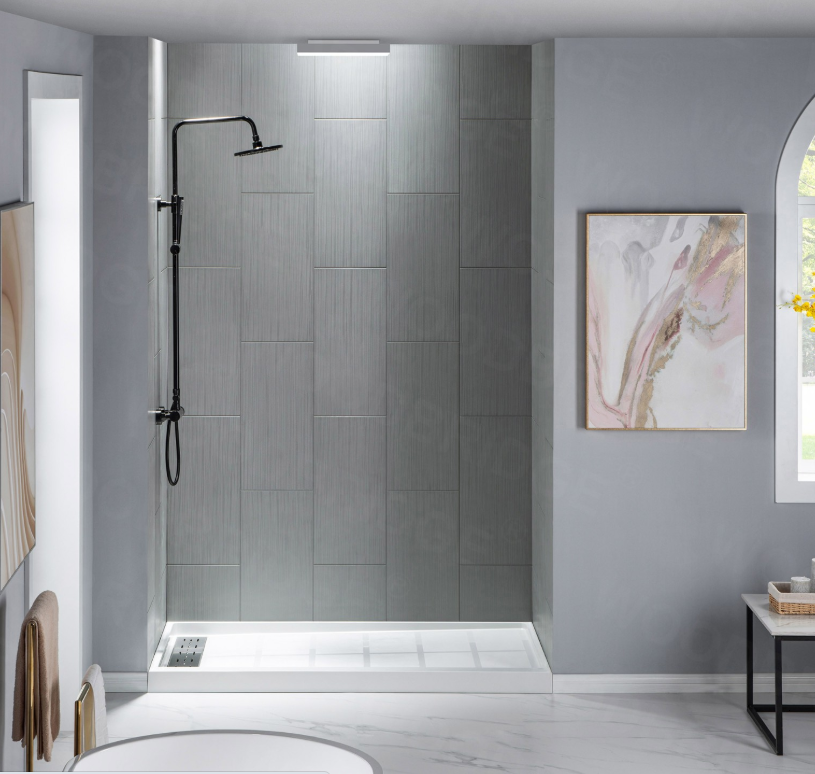 Modern walk-in shower with gray tiles and black showerhead, adjacent to a light gray wall with abstract artwork and a window.