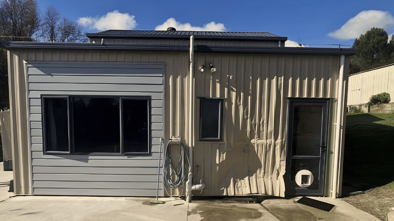 House cladding damaged following vehicle impact, before insurance reinstatement, Tauranga