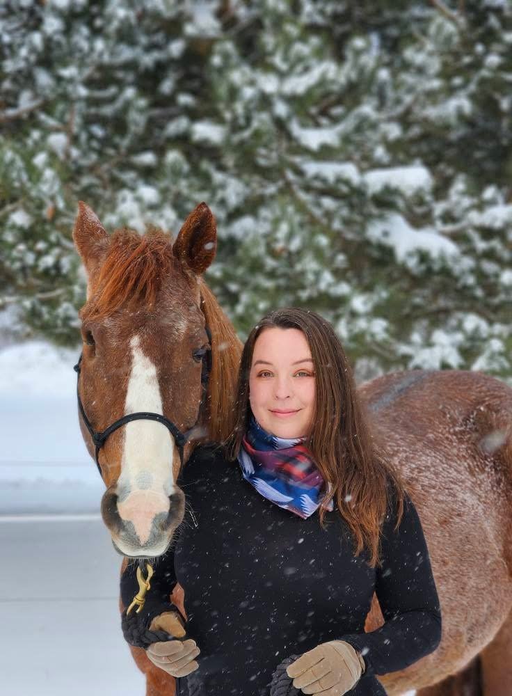 EZ Equine Nutrition consultant standing with a horse in a snowy Wisconsin pasture