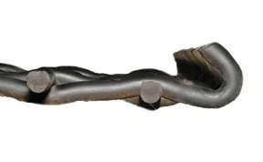 Close-up of a metal pipe with a bend and round fittings against a white background.