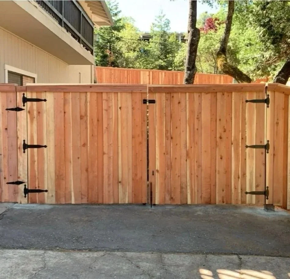 Professional gate and fence installation at a residential property.