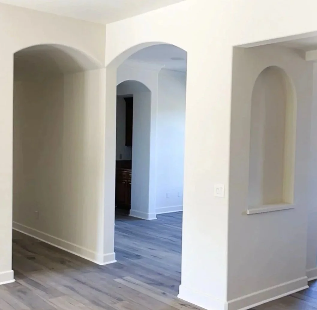 Finished interior painting project featuring crisp white walls in a residential home.