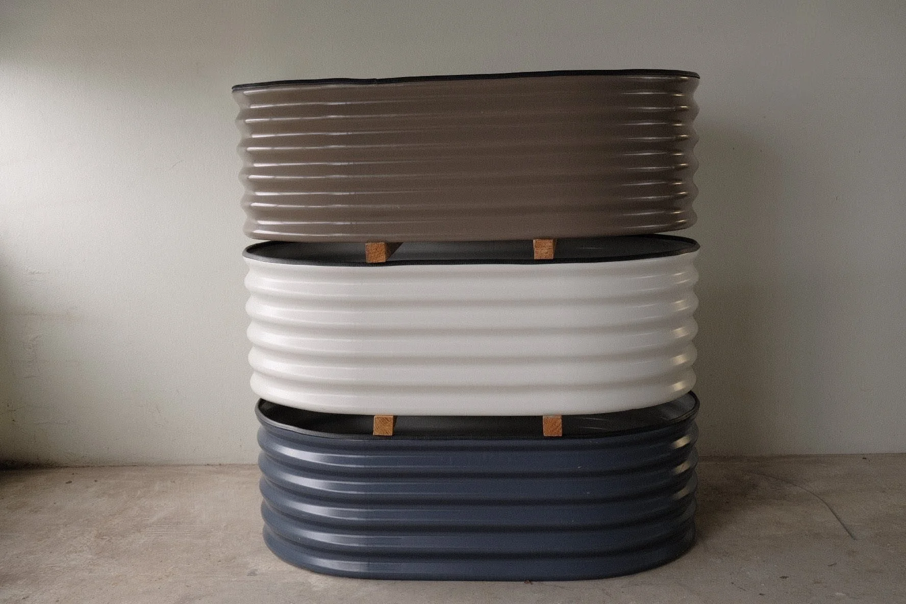 Colorbond raised garden beds in surfmist deep ocean and brown stacked on top of each other. Built to the last, made to last in Perth WA