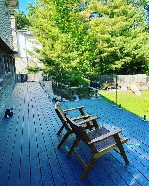 multi-level composite deck with glass railing in Mississauga